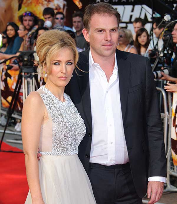A photo of Julian Ozanne and Gillian Anderson.